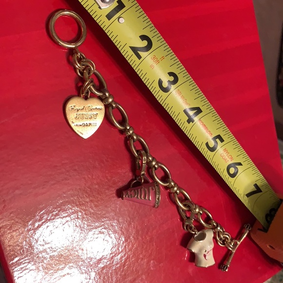 JUICY COUTURE 3 CHARM BRACELET. ONE NOT REMOVABLE